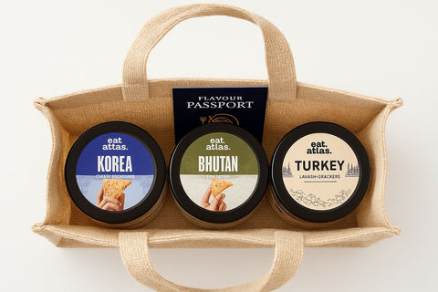 International Flavors in a cute Jute basket- Bhutan and Korea Dip (200 gms each) with Lavash Chips (85 gms)